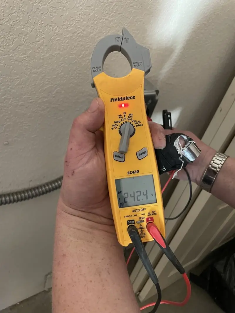 Voltage testing with clamp meter during Generator Installation in Fitchburg